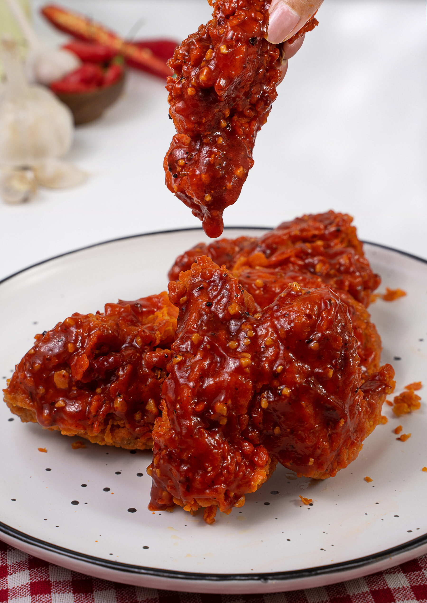KFL sauce, thick and glossy, dripping off a spoon